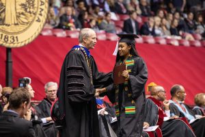 president congratulates graduate