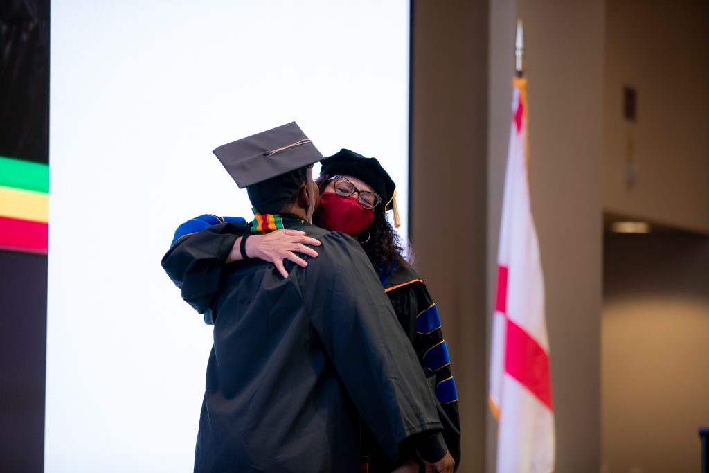Student embraces faculty member
