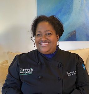 woman wearing black chef's jacket